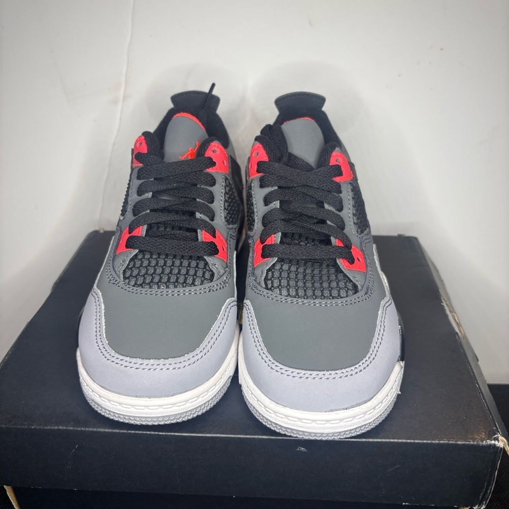 Jordan 4 Grey and Black Athletic Sneakers with Red Accents